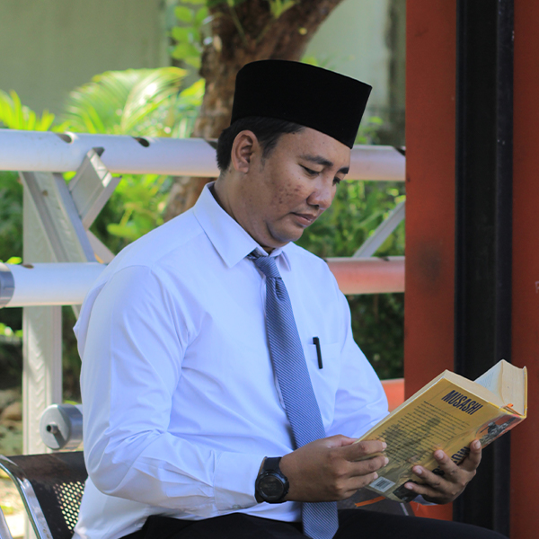 Roziq Fathul Husain, S,Pd.